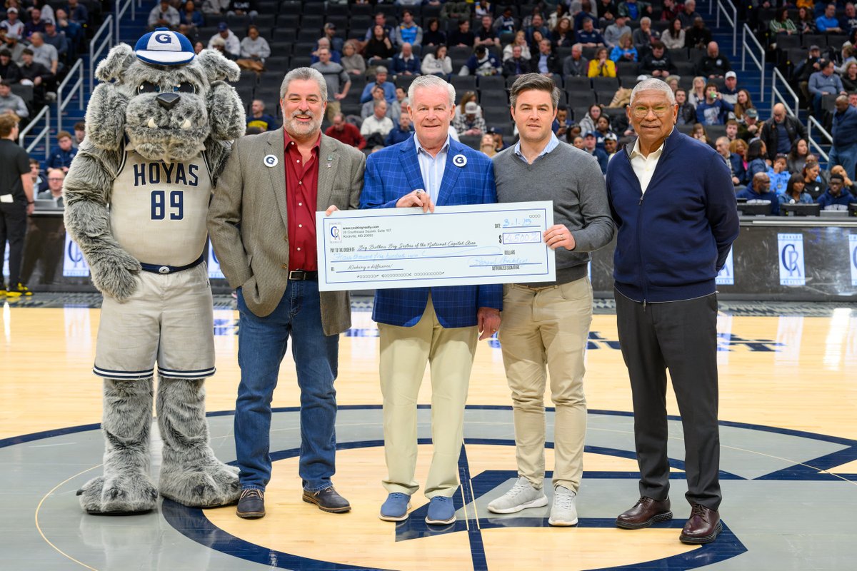 During an exciting game between #HoyaSaxa vs. #MarquetteGoldenEagles, former Chairman Rory Coakley of #CoakleyRealty presented a $4,500 check to #BBBSNCA! Their #donation will have a direct #impact on our mission to mentor at-risk youth in our #community.  

@georgetownhoops