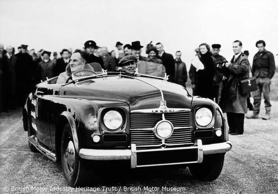 In #March 1950 the #Rover JET1 was unveiled to the public as the first car to be powered by a gas turbine engine. This #Photograph from our #Archive shows the car being driven by the Rover Company Technical Director, Maurice Wilks, at the unveiling event. 📷💨
