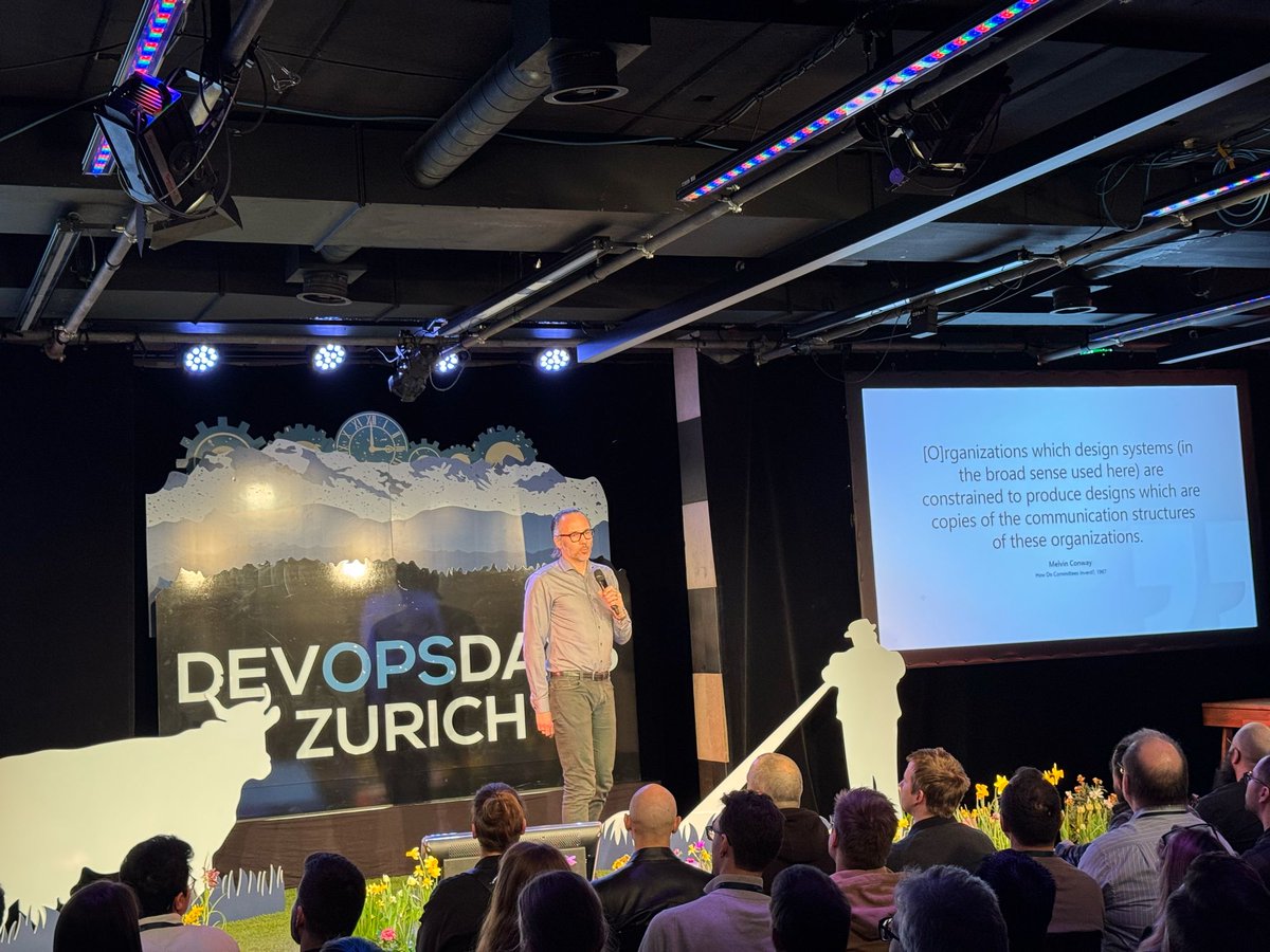 📢 Insightful ignite talk by Rasmus Lystrøm: "Post Accelerate: Why are we still failing at DevOps?" 🚀 Lessons from 10 years of consulting on enterprise adoption struggles &amp; solutions. Thought-provoking! #dodzh #DevOpsDaysZH