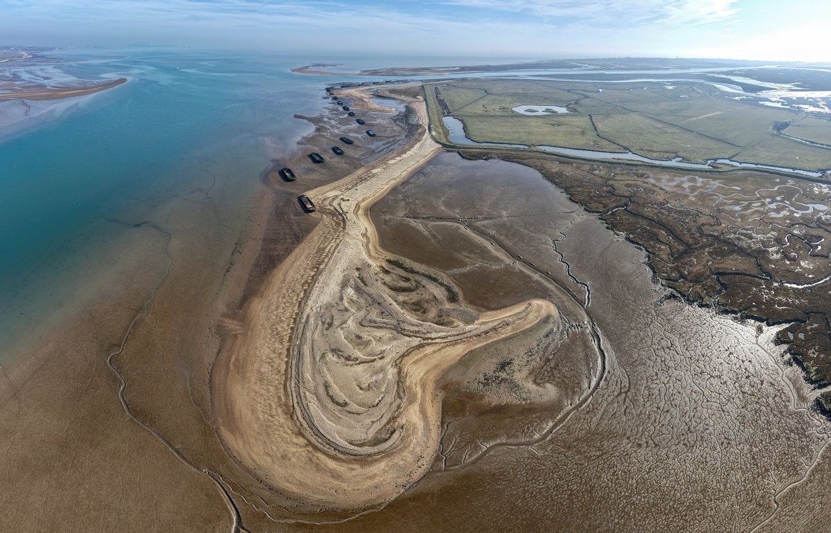 A photograph taken in March 2025 showing harbour dredging's placed around the NE corner of Horsey Island in Essex.  Foreground sandbank was placed in 1998 -  toward the top of photo was placed in 2021.