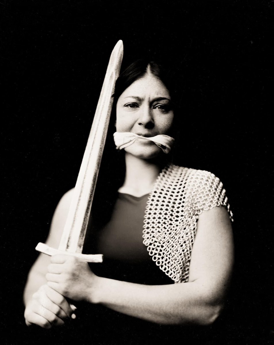 "Gagged Justice" with Kailey Creswell, captured in the historic wet plate collodion process of silver on glass.  Plate 1 of 2 for the diptych.  Assited by Laine Pope my propmaster.  

Carl Zeiss Tessar 250mm lens, f4.5, 9 seconds of exposure, natural light