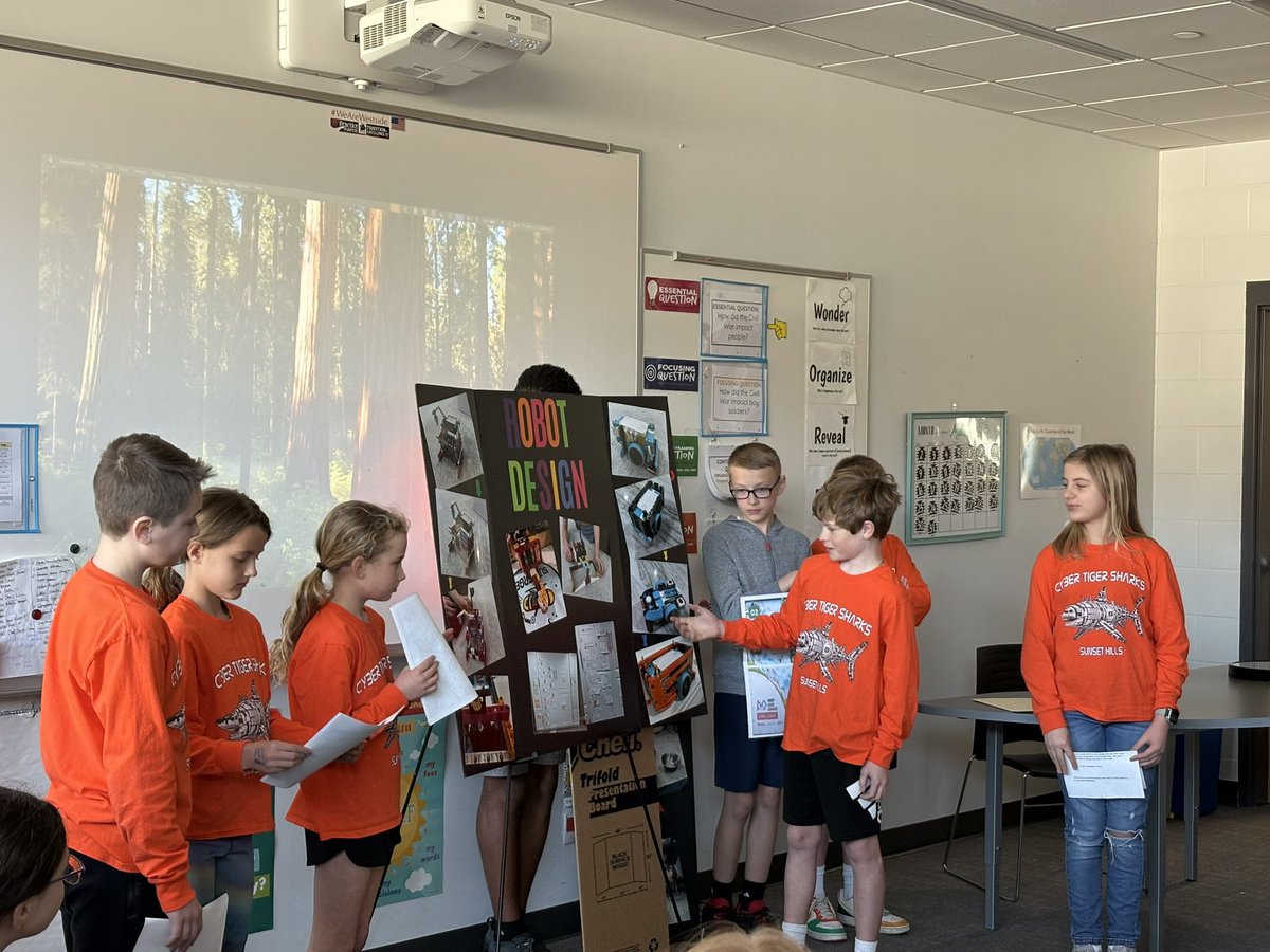 Our amazing Robotics team sharing their project with their classmates!