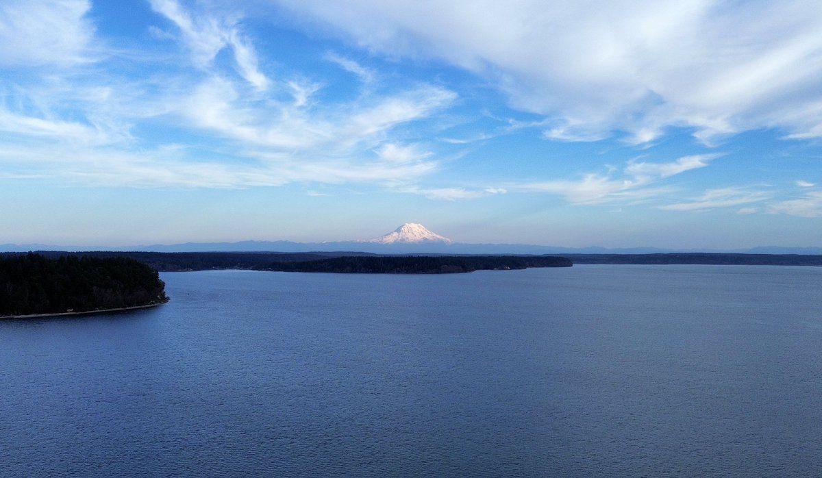 Mount Rainier dominates the horizon looking east across Nisqually Reach, with Anderson Island and the tip of the Key Peninsula in the foreground. What a nice day across the #PNW! #wawx #drone #MtRainier