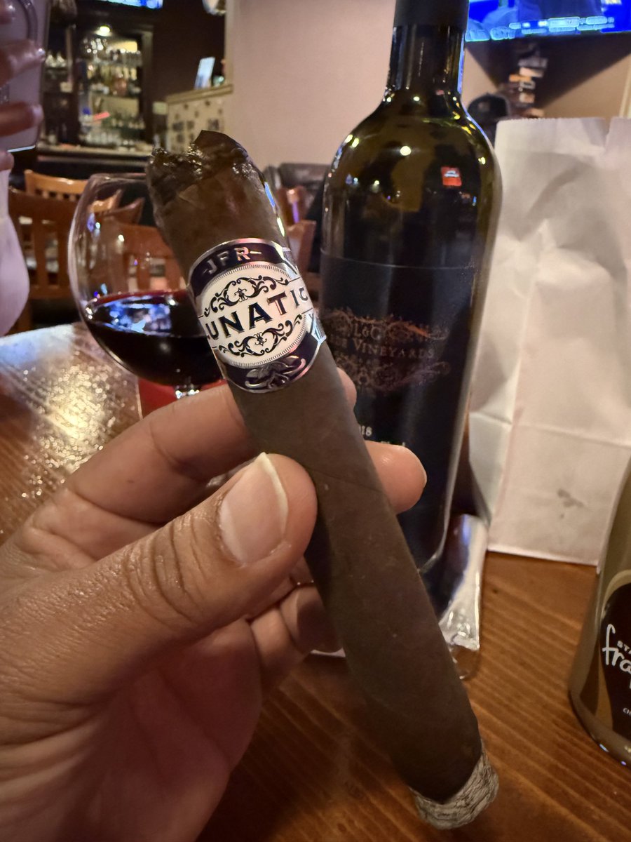 A nice glass of wine and lunatic #cigar this evening.