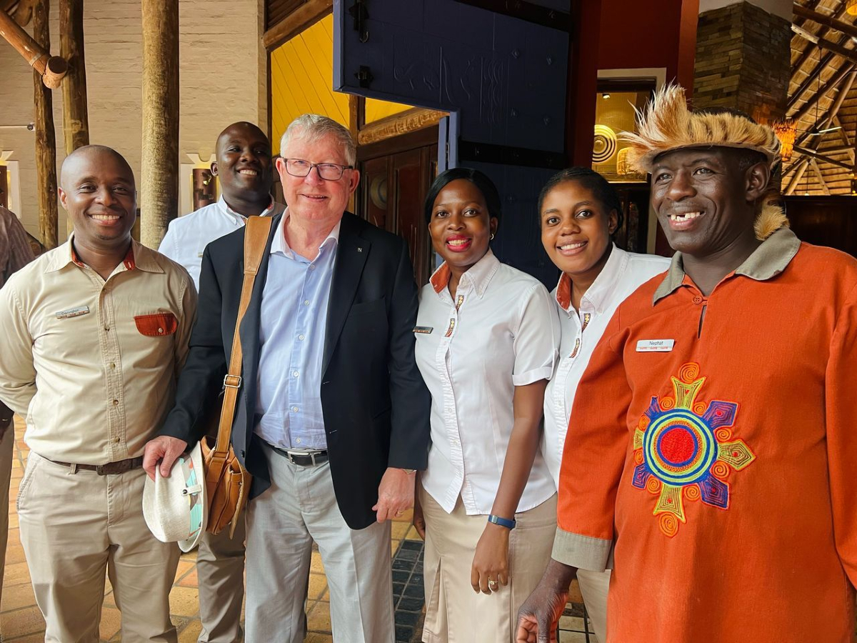 Sir Alex Ferguson is currently visiting Victoria Falls, where he was spotted posing for a photo with the staff of Victoria Falls Safari Lodge. 

It is a remarkable moment for both the legendary football figure and the team, set against the backdrop of one of the world’s most
