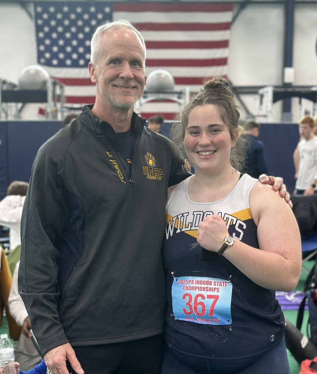 Zoe sporting her brand new commemorative watch for winning her event. One proud coach standing alongside the state champ!