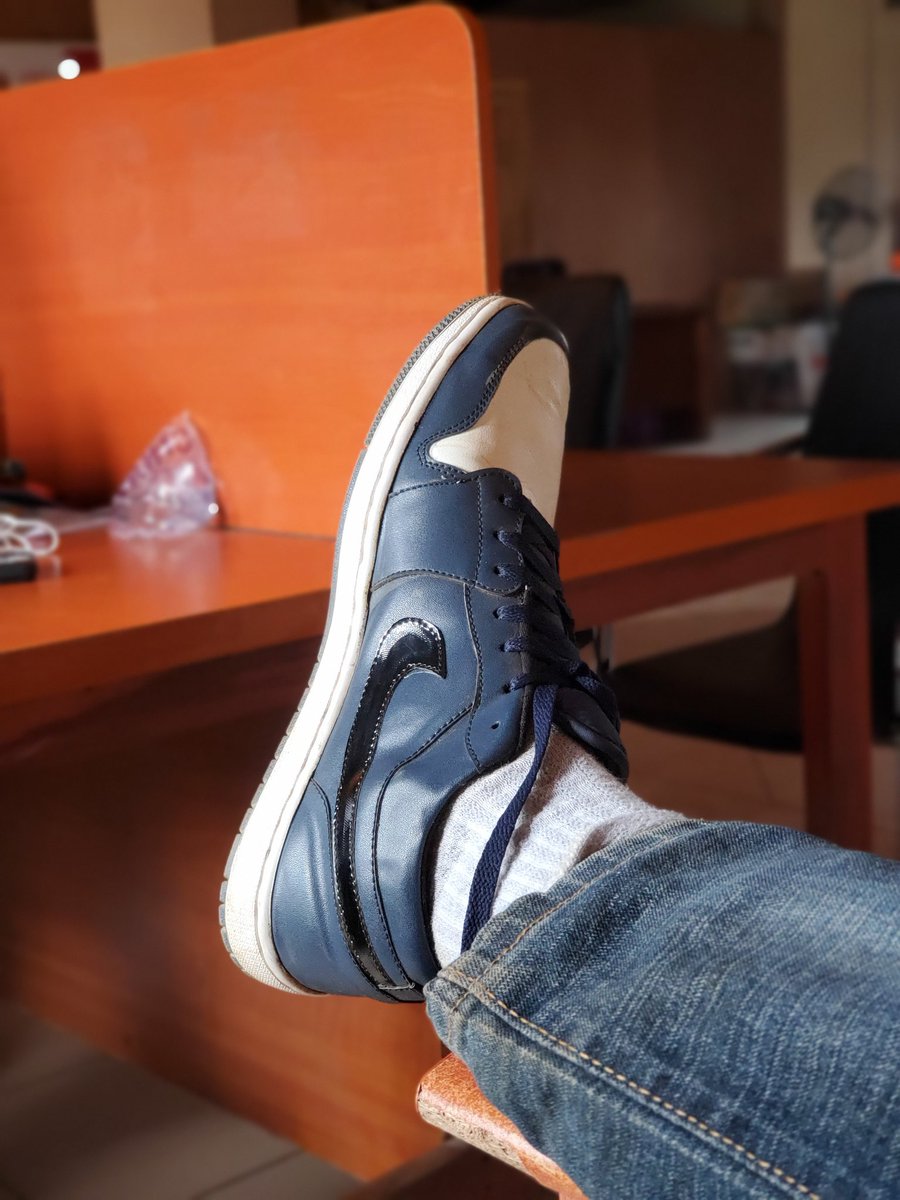 Makinwaife's tweet photo. My brother wanted to discard a pair of old air jordans. I picked them up, salvaged some parts  and made a new pair from it. https://t.co/vQdGrvSqY7