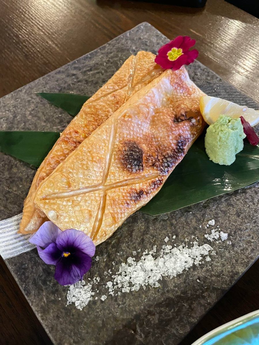 Design_maker21's tweet image. Savoring a beautiful Japanese meal: grilled eel (unagi) with a perfect glaze, served with lemon and wasabi, alongside vibrant sushi rolls featuring tuna, salmon, and shrimp, with pickled ginger on the side. A true taste of elegance!