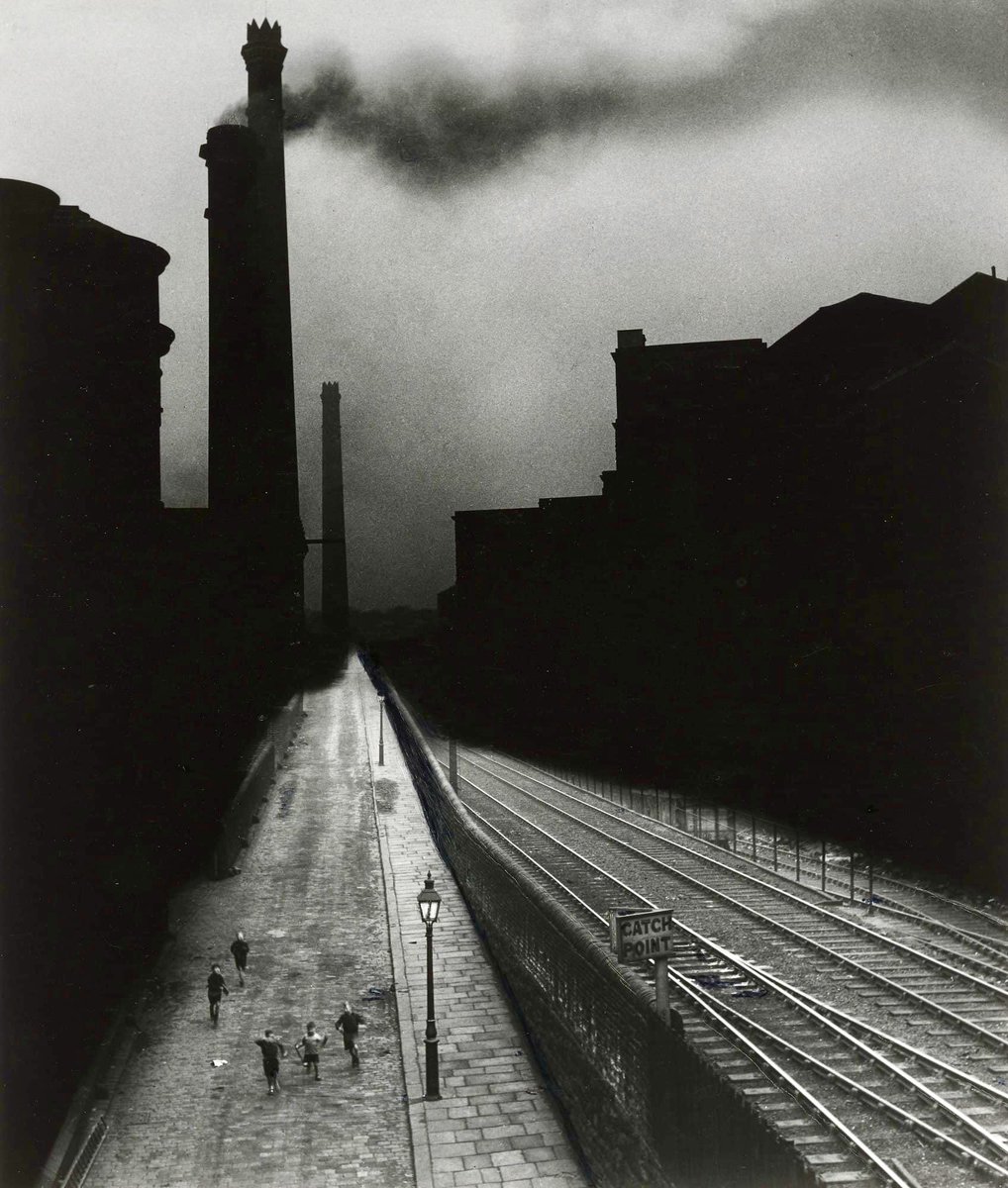 Of all the photographers’ work we’ve shared, Bill Brandt’s has always stood out for me. 

This poignant scene of children caught in a pocket of light against a dark, brooding industrial background has long been a personal favourite. 

Halifax, 1937 by Bill Brandt (1904-1983)
