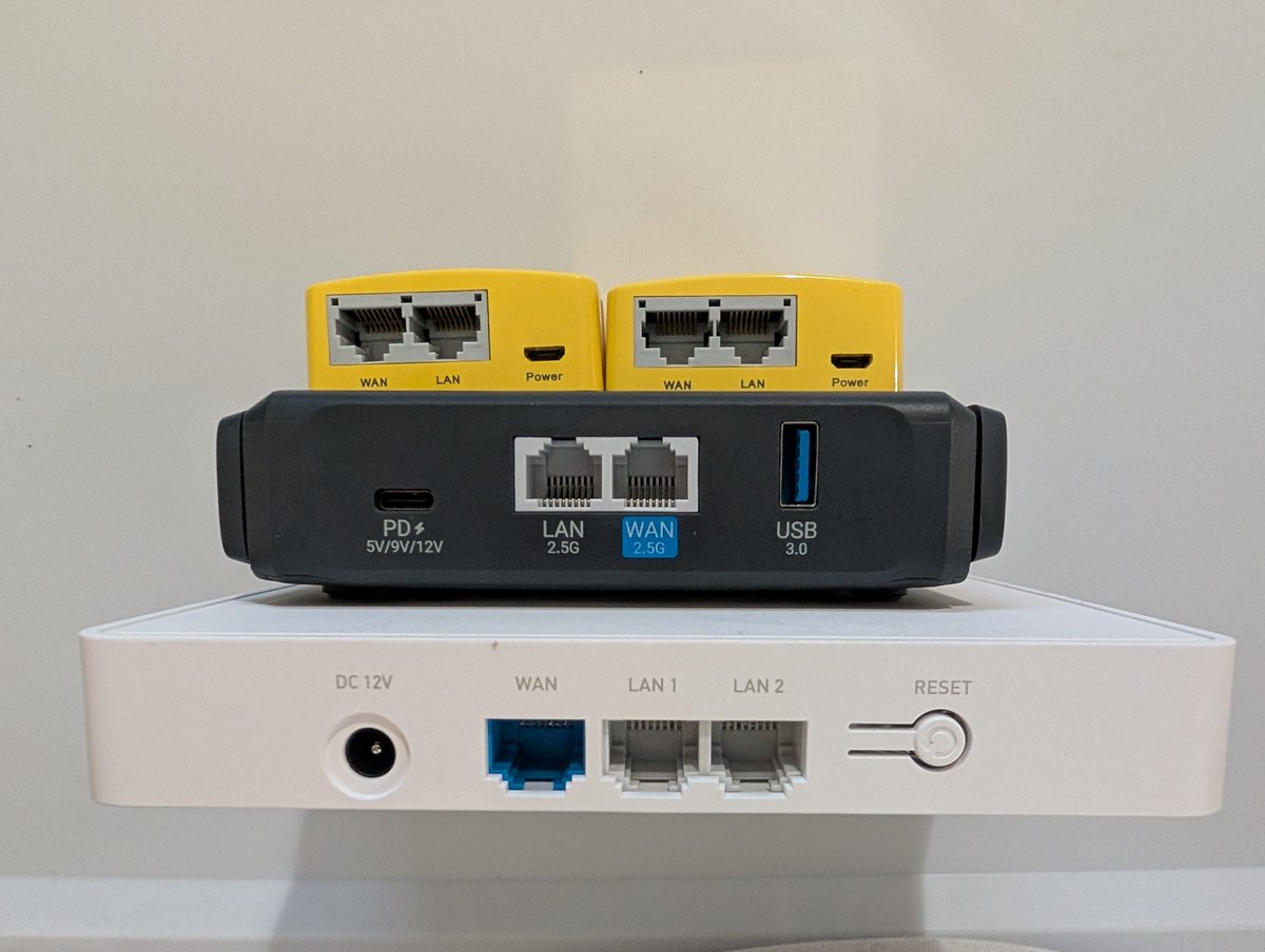 vojimen's tweet image. Just showing off some of my @GLiNetWiFi gadgets (routers).

In the picture:
- Marble
- Slate 7
- 2x Mango (the @Blokpax sticker on one helps me identify which is which).