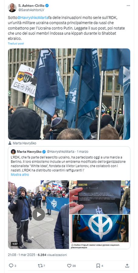 Look who is in Berlin. American transgender   "Sarah" Ashton-Cirillo now dressed as a man, spokesperson of the Ukrainian army, was seen at the rally of Ukrainian Nazi militias including the Russian Volunteer Corps Fighting for Ukraine. 
He attacked Ukrainian historian Marta