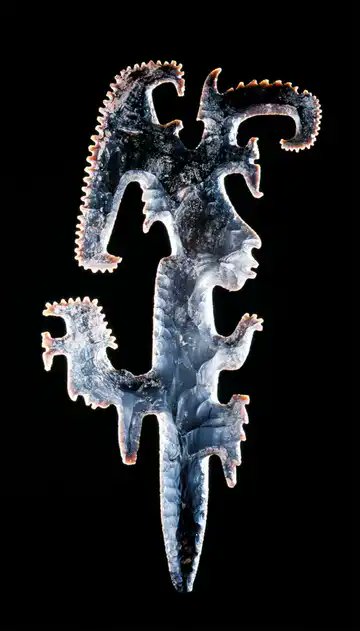 An Obsidian Axe (600-900 AD), perhaps represents an ajaw. In Palenque, such objects were deposited in the foundations of buildings or placed in tombs.

An eccentric flint, an elite chipped artifact of an often irregular ('eccentric') shape produced by the Classic Maya
