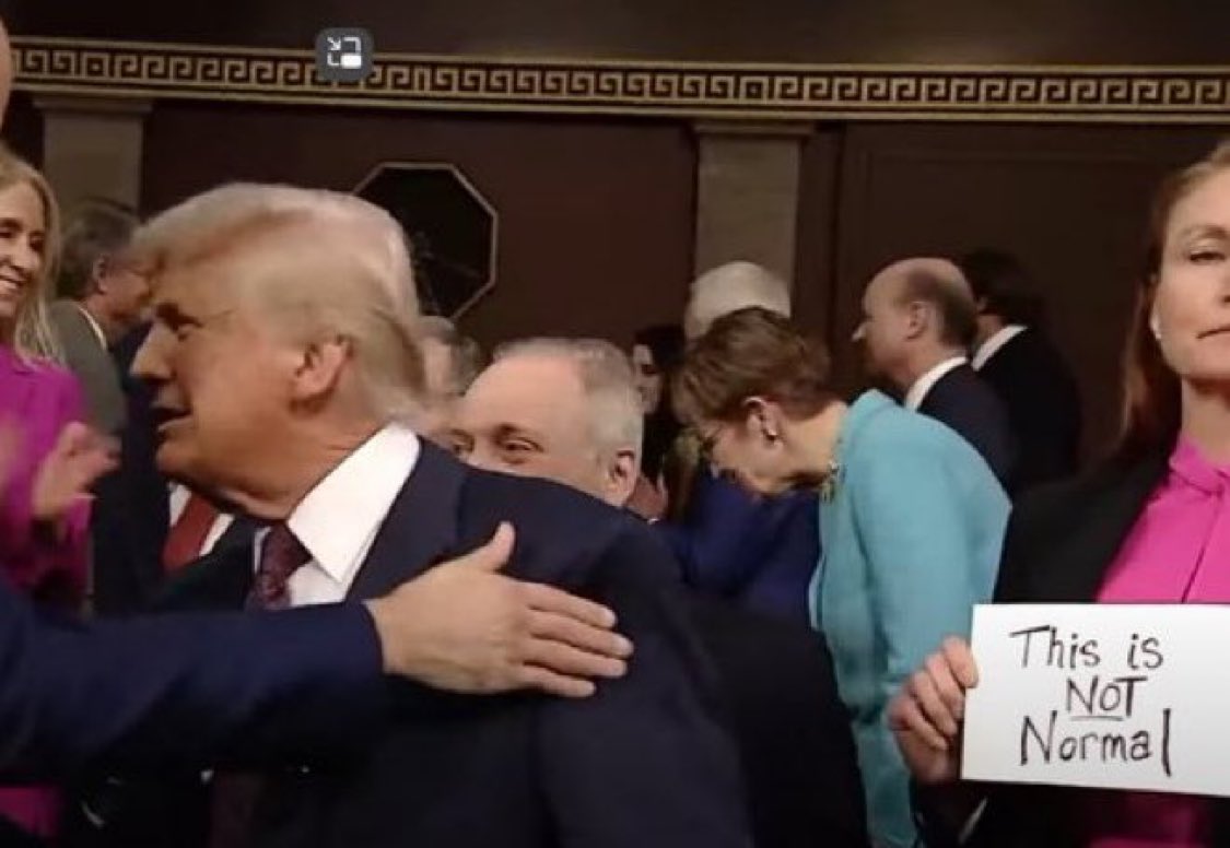 Congresswoman Melanie Stansbury with a sign saying “This is not normal”. #StateOfTheUnion