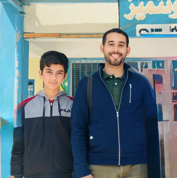 Just found this photo of me and Hatem on my phone. It was taken in May 2022.
Hatem Al-Za’aneen was my most talented student. He got killed in October 2024 while searching for firewood to help his family survive. It’s still a nightmare for me.
He used to wait for me at the end of