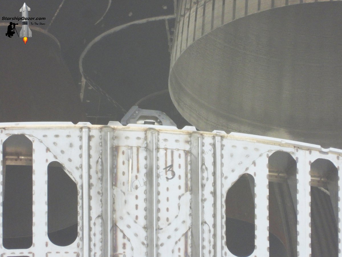 A piece of the hot stage ring clamp seen here detached during stacking and has caused stacking to be paused. 

3/5/25