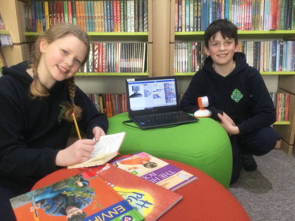 stjhighgate's tweet photo. A Robot In The Library! A big thank you to Cillian and Sadie from Amethyst for coding the Picoh robot for our library! BookyKid will assist our students in selecting books based on their year group and preferred genres. #reading #worldsbookday #Picoh #LGfL https://t.co/FtWjc8iECy