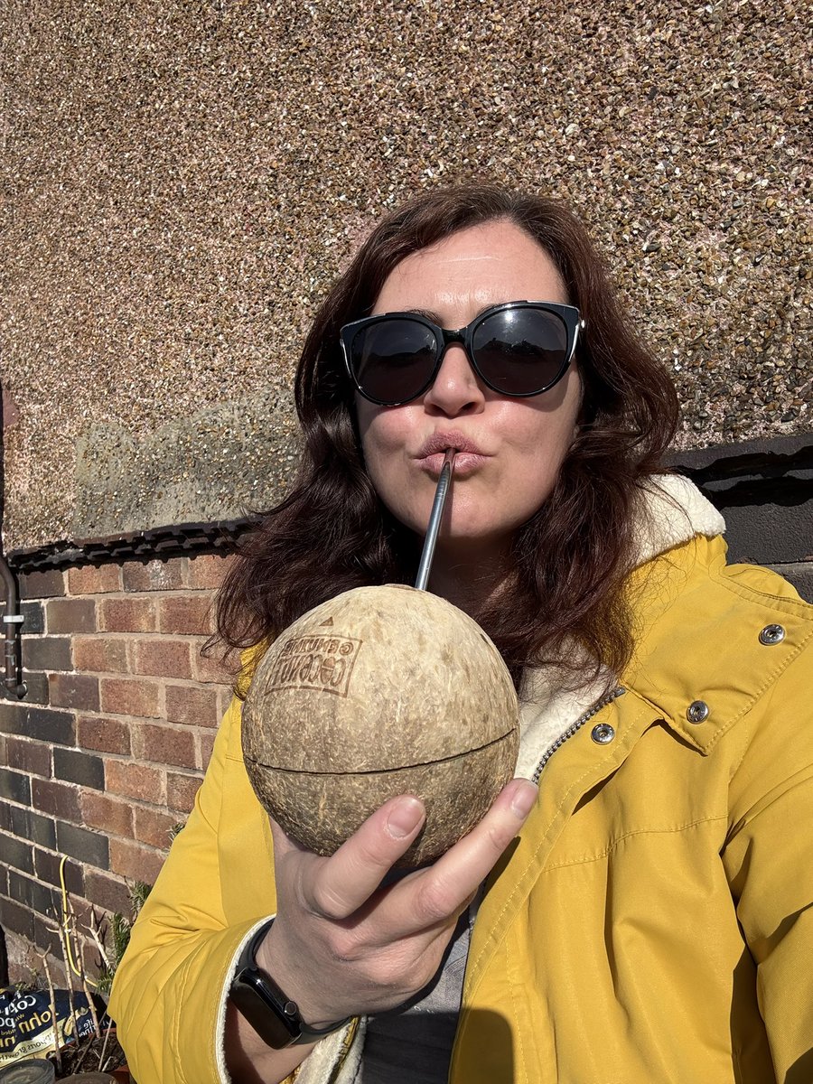 Not ready to surrender the big coat but happy to sip on a coconut in the sunshine ☀️