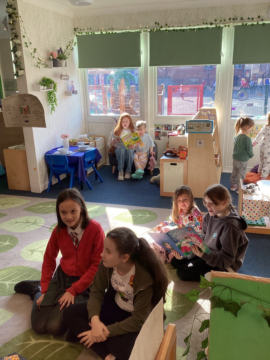 Reading with a buddy - Year 6 and Nursery for World Book Day