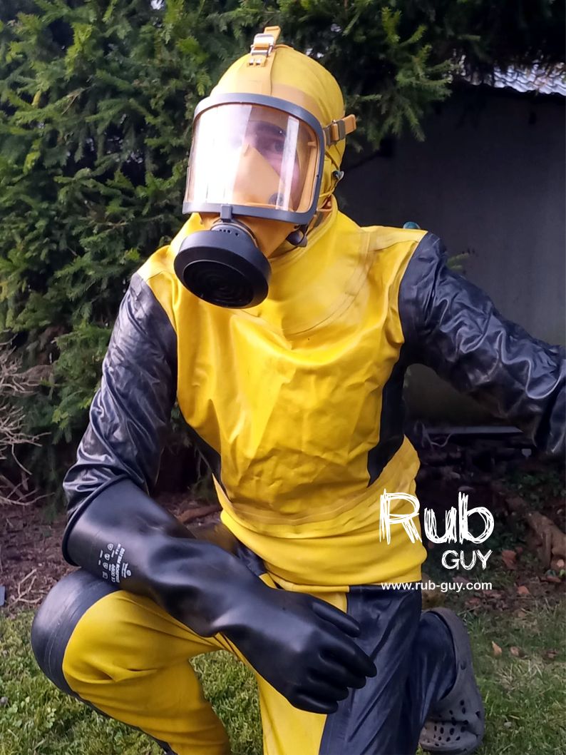 In russian rubber diving suit Sadko (садко). Thick rubber gloves and yellow Dräger panoramatic gas mask.