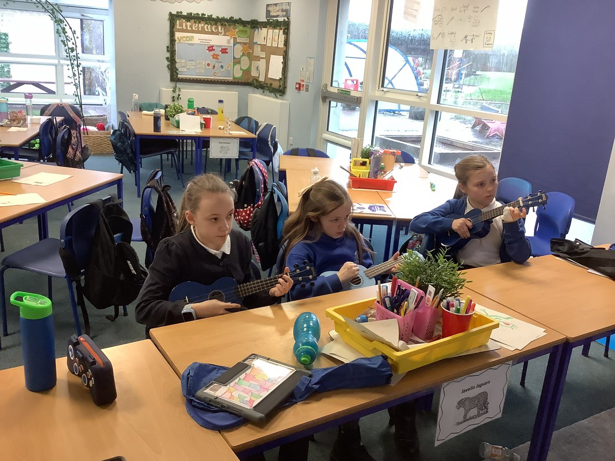 The music leading the learning group enjoyed learning to tune a ukelele and play some chords.