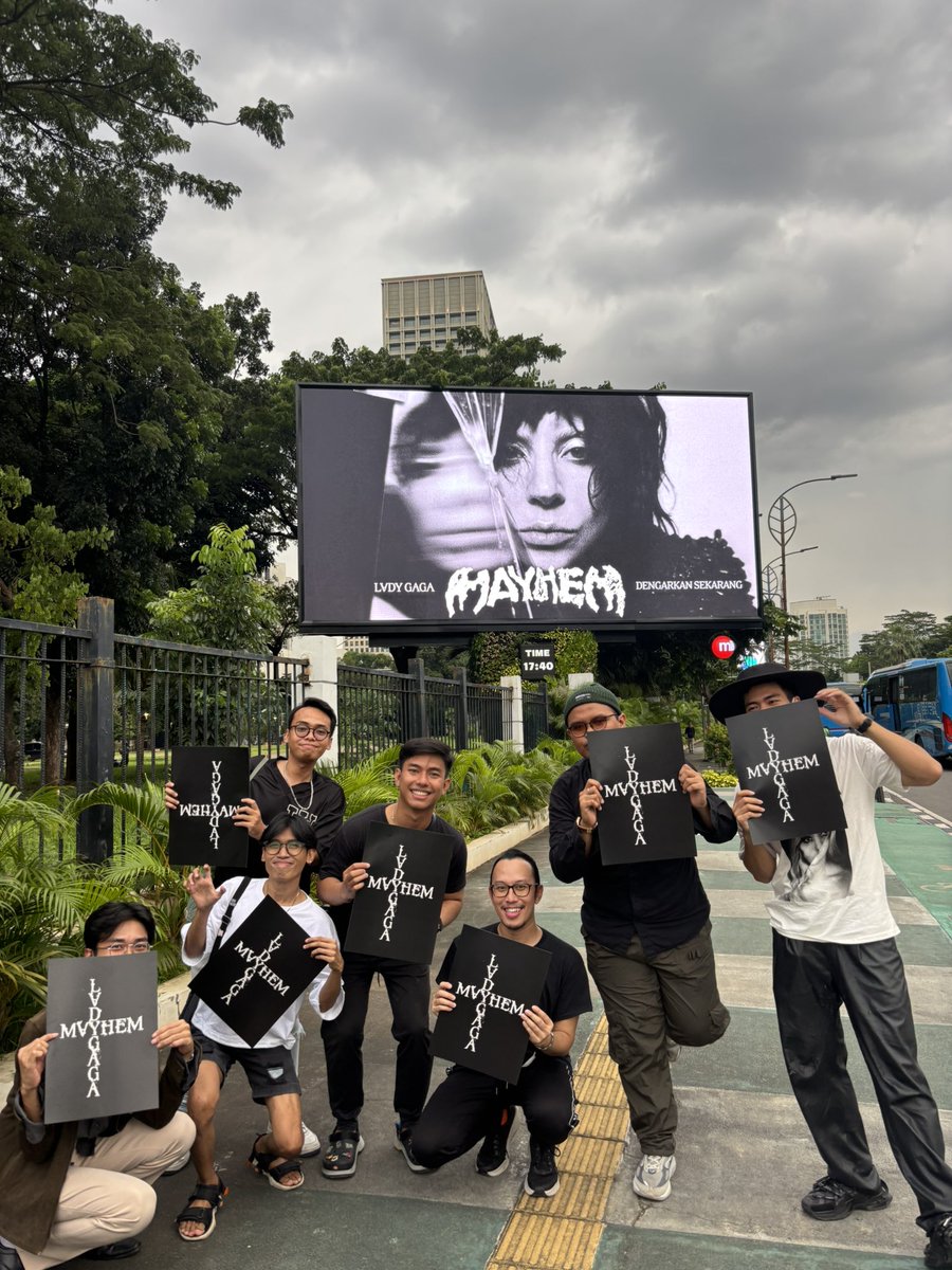 Little Monsters Indonesia posing with MAYHEM billboard in Jakarta, Indonesia