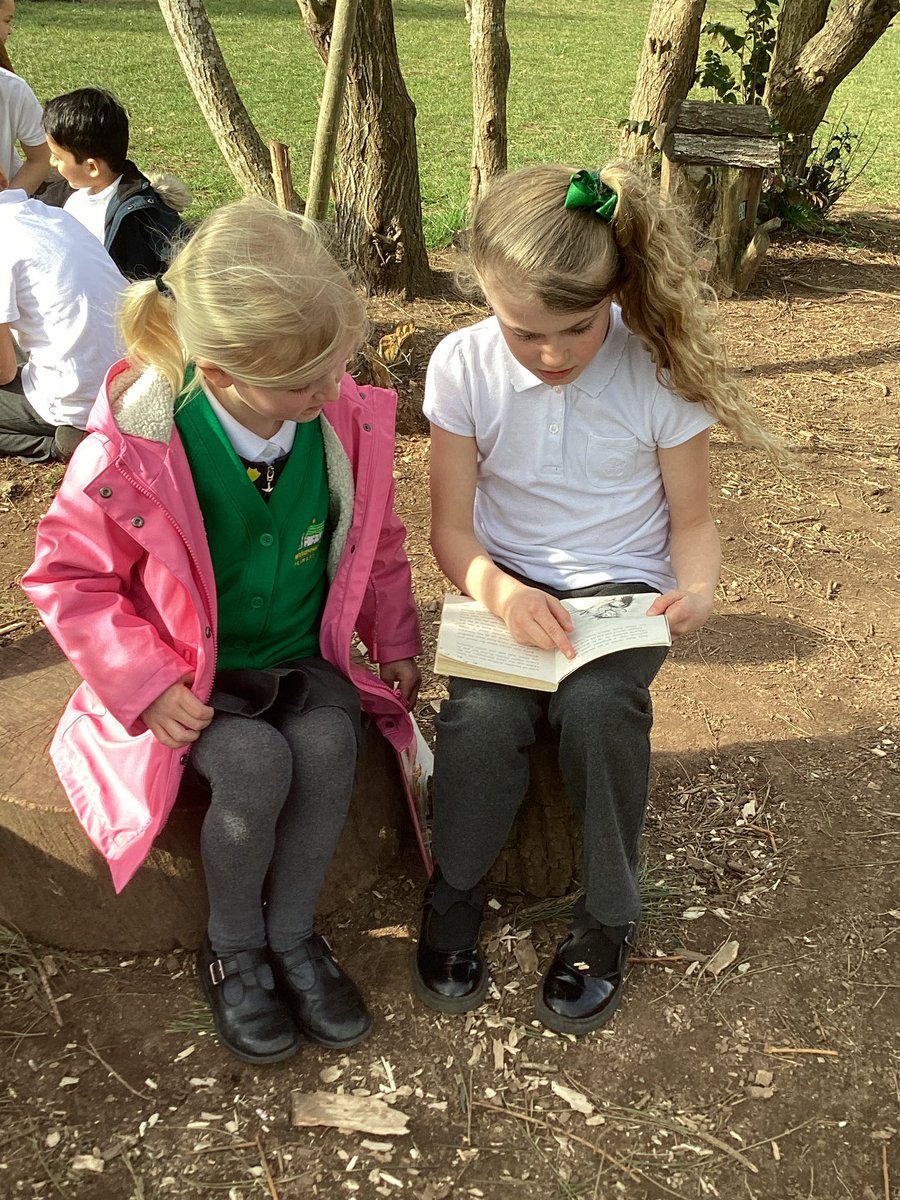 whcps's tweet photo. Year 1 are having a great time completing buddy reading with Year 4 in the sunshine. Great to hear them reading to each other and discussing the stories so well. #whcyear1 #whcyear4 @WorldBookDayUK https://t.co/bPSJMpI83N