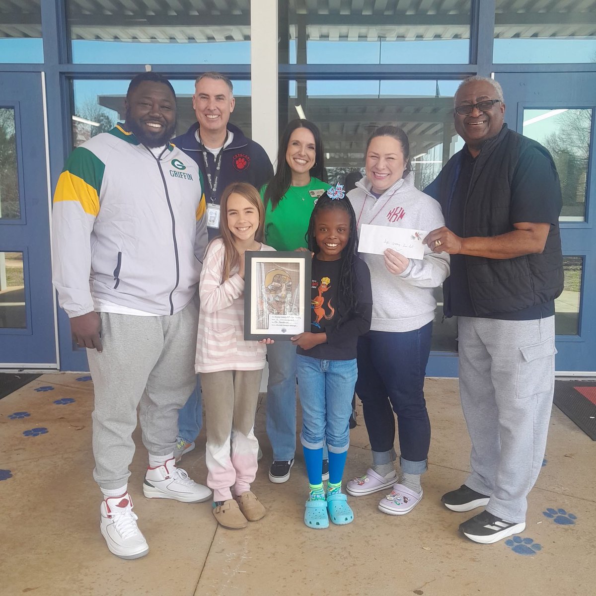 Thank you to Ms. Kelso-Art Teacher,  Kinlee &amp; McRae-our talented 4th-grade artists, for creating this incredible mixed media tribute!
Mr. Goodrum dedicated so much to GSCS, serving in many capacities &amp; leaving a lasting impact on countless lives. <a href="/GriffinSpalding/">Griffin-Spalding K12</a>