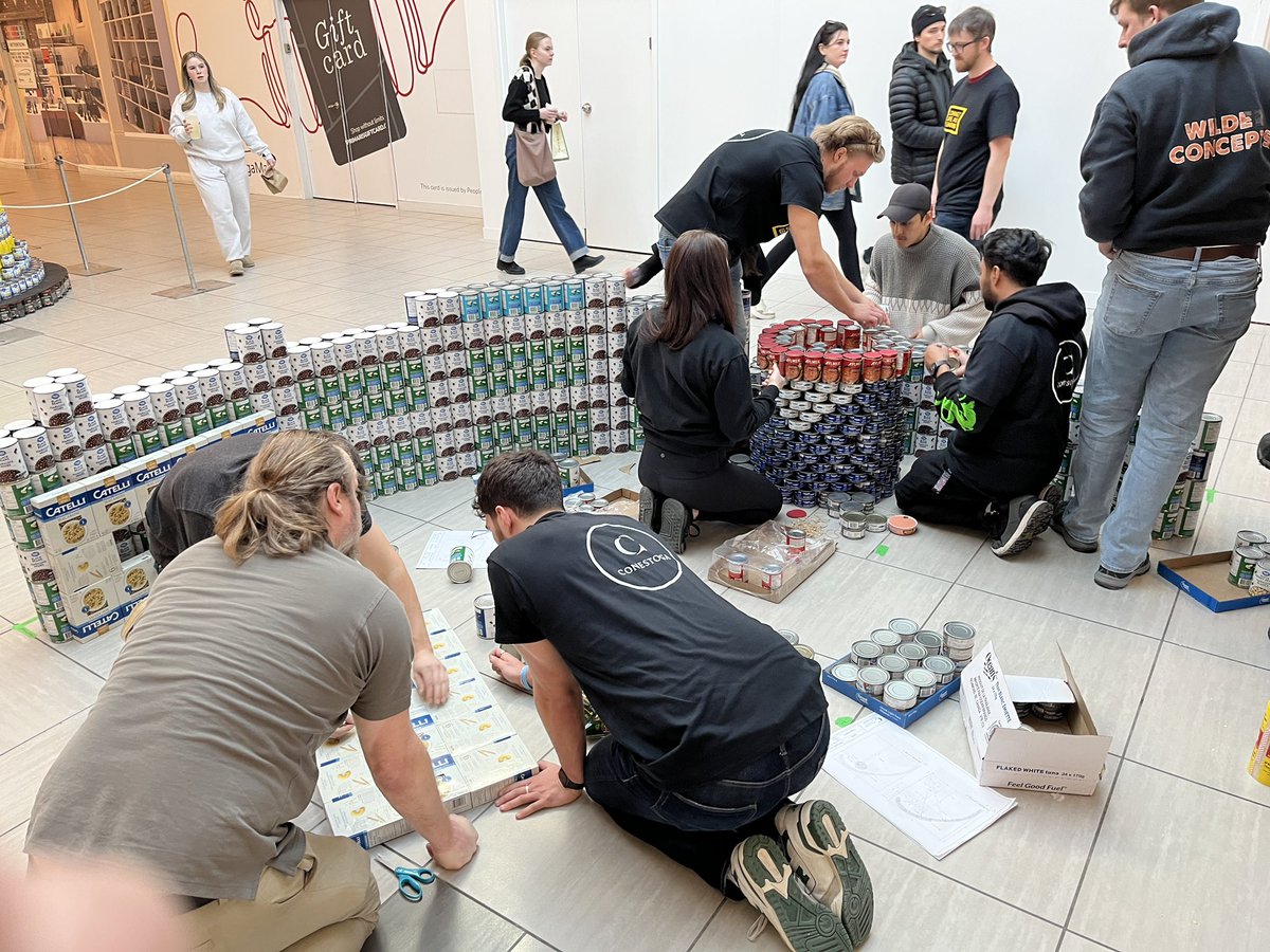GerrardJim's tweet photo. @ACETconestoga is once again back at @Canstruction in support of the @FoodBankWatReg .  CAN you guess what we are building?  Go team ACET!!! #canstructionwr https://t.co/4rd90RVd4m