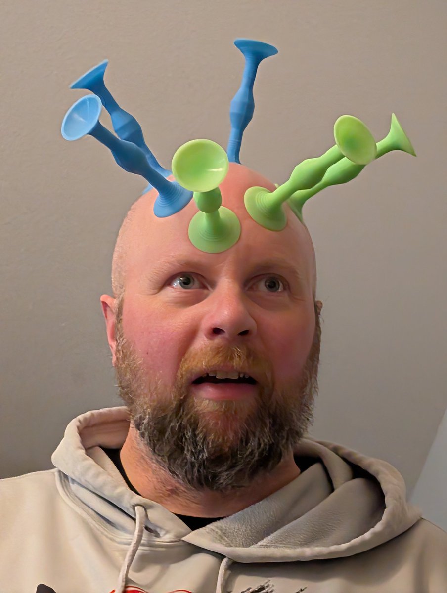 Dspot33's tweet photo. Hey @Popdartsgame I didn't know you could compete by throwing at your father's head! Who wins here? Blue or Green? https://t.co/UnSZUBjW8E