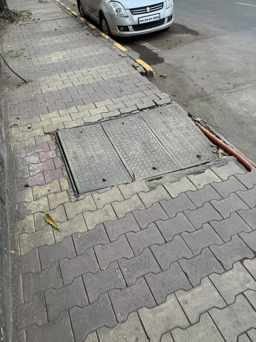 prafuluberoi's tweet photo. @NMMConline , the manhole on the footpath has severely caved in and can be very dangerous. Please look into it. This is outside safal complex nerul near cottage land https://t.co/9oTGVBWZEg