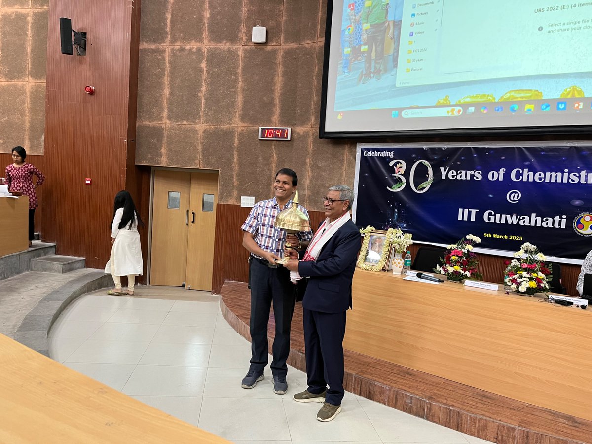 Prof A T Khan being felicitated by Prof. B K Patel