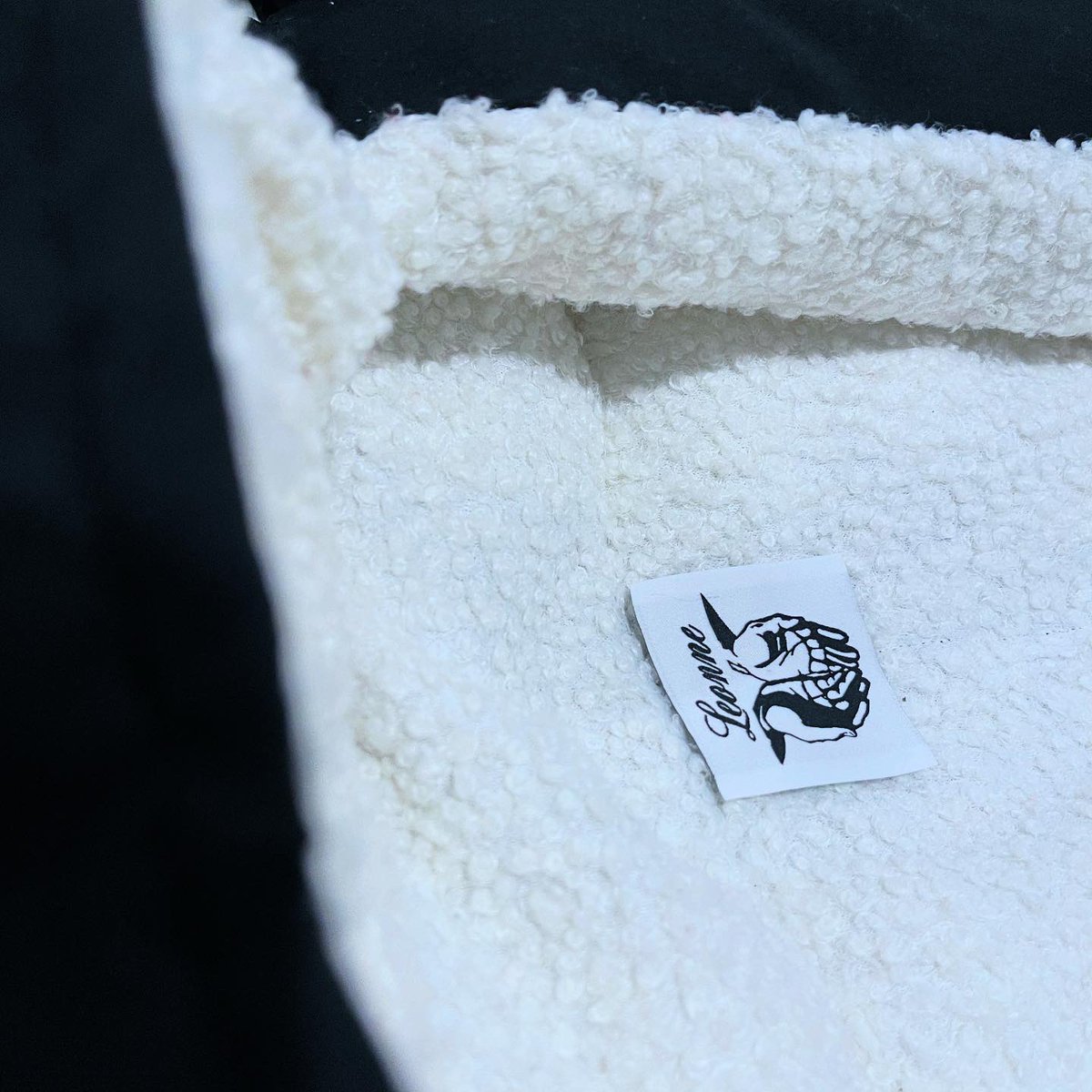 Handmade in house, with 100% sustainably sourced nylon and ethically produced sherpa, Designed with a waterproof shell, wind-resistant hood and wind guards, and snap closures.

Out NOW
Leonne-Capsules.com