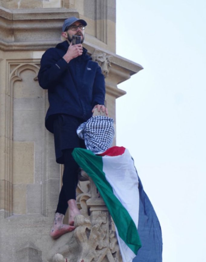 A man has climbed Big Ben next to the Houses of Parliament in protest against British support for Israel and has been up there for the whole day, but there seems to be a media blackout on it.