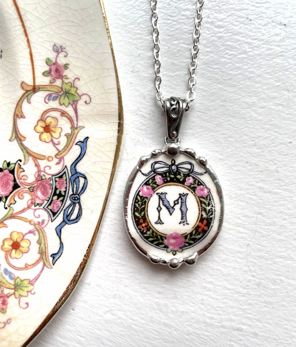 Broken china jewelry, capital letter M monogram initial oval pendant necklace, antique ornate rare china, upcycled Dishfunctional Designs #M #brokenchina #brokenchinajewelry etsy.me/3XCxg3X via <a href="/Etsy/">Etsy</a>
