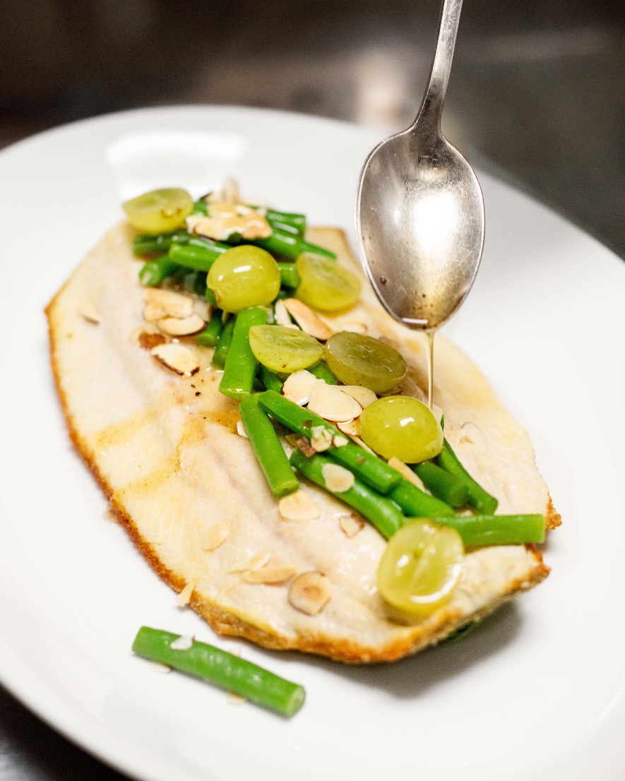 Light, bright, and beautifully plated. Our Georgia Mountain Trout, finished with sautéed spinach, crisp snap beans, green grapes, toasted almonds, and a drizzle of lemon, is a must-try 🍋