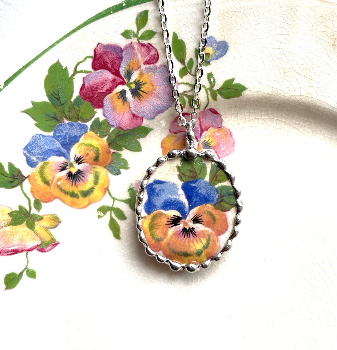 Broken China Jewelry BLUE IVY GRAPEVINE heart pendant necklace,  made from recycled upcycled china, Dishfunctional Designs #brokenchina #brokenchinajewelry #pansyflower Upcycled China etsy.me/3FozkGp via <a href="/Etsy/">Etsy</a>