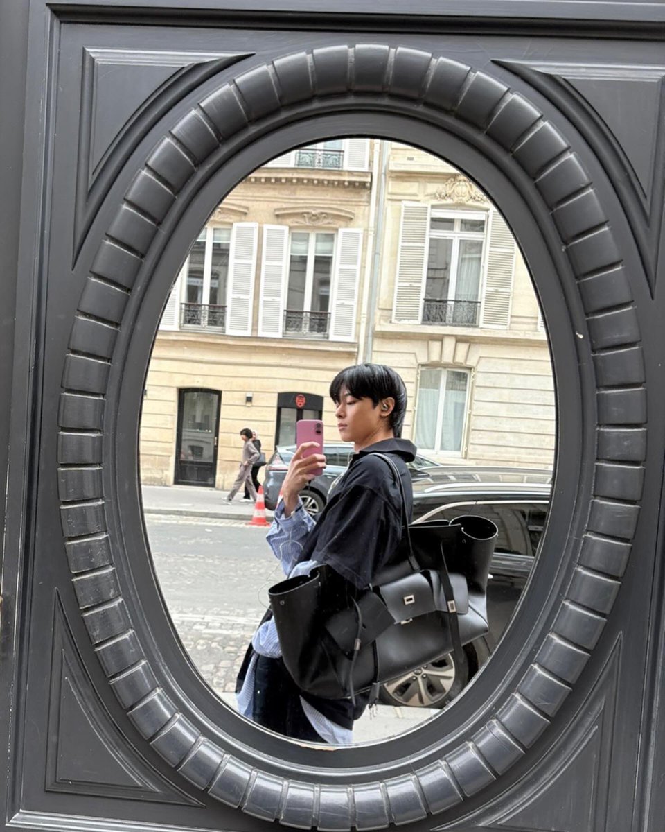 A reflection framed in time, a fleeting moment held between past and present. Somewhere between here and there, I find myself.