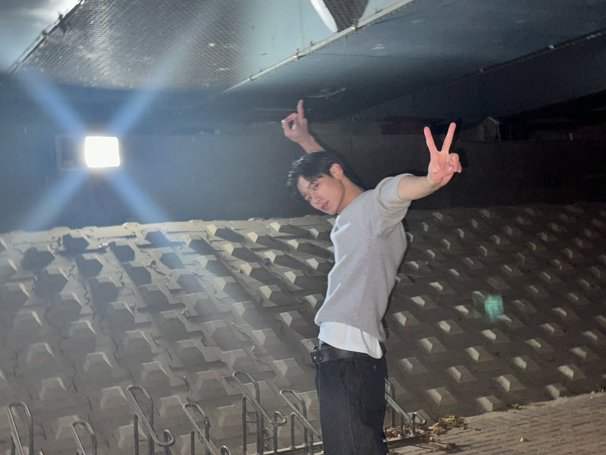 A small light in the dark—almost insignificant, yet demanding attention. Perhaps it’s not guiding the way, just proving it exists.