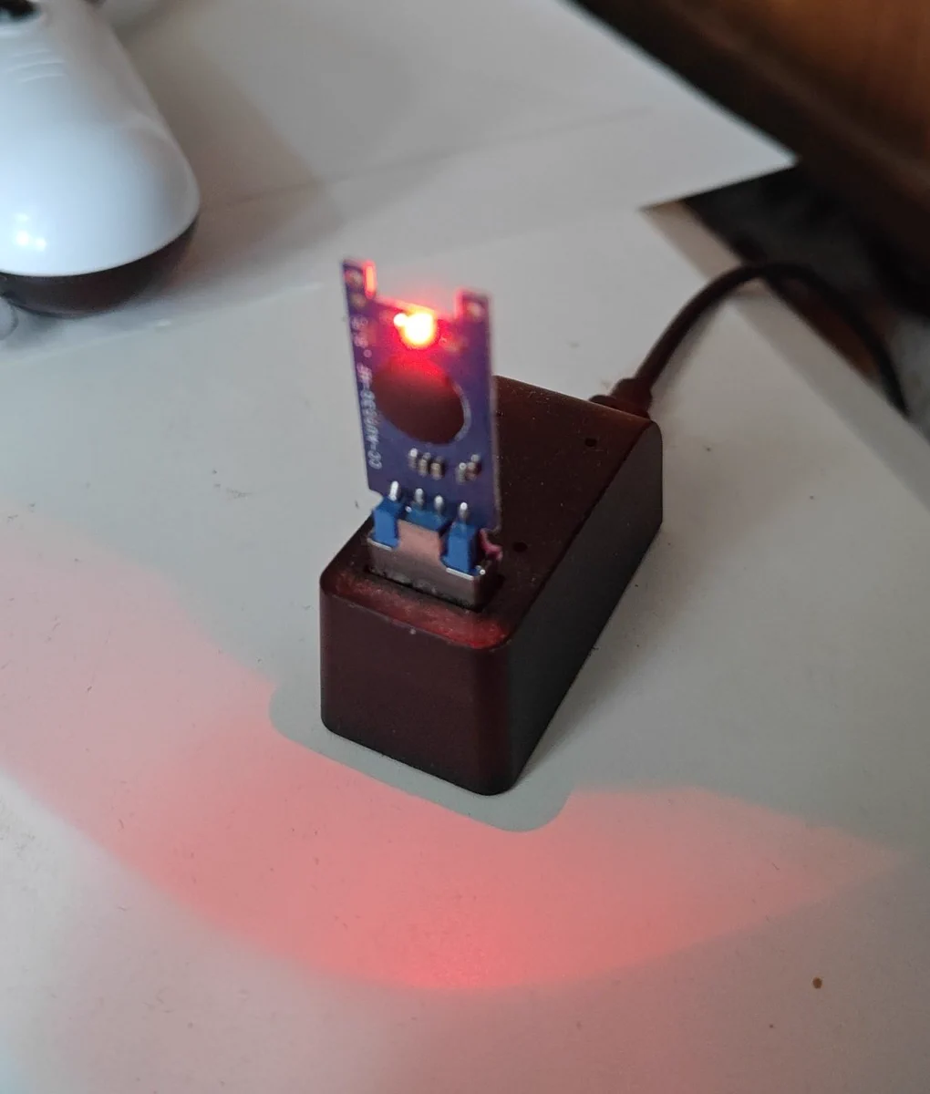 A naked USB inside of a Stream Controller dongle dock