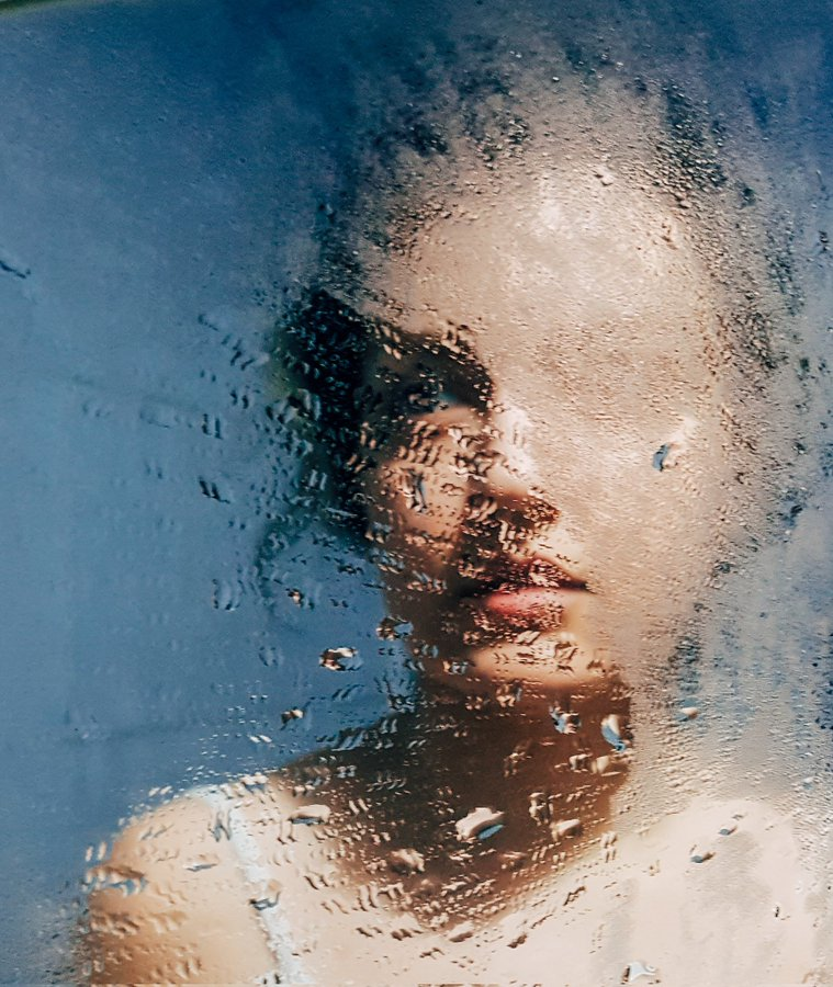"Blue mind" where a woman's face emerges behind a misted glass, partially obscured by droplets of water and the condensation distorts her features. 

Just bought a new NFT! This will be added to my collection

#NFT #NFTCommunity #NFTCollector