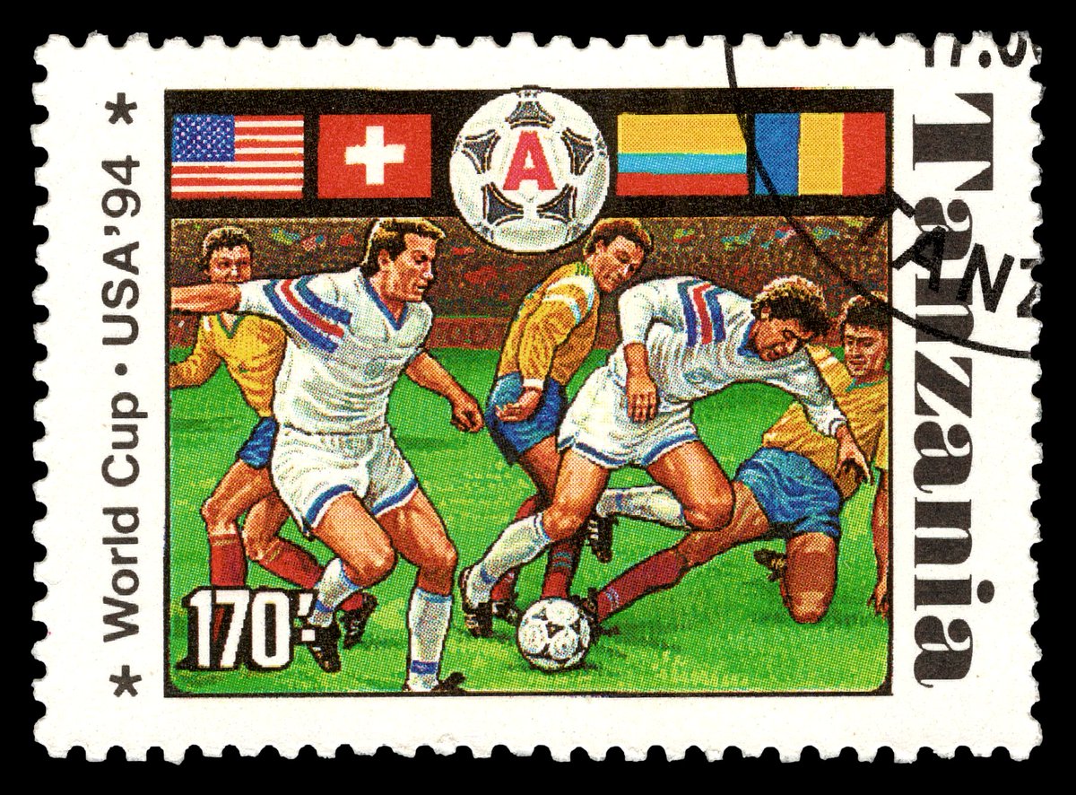 tifoteca_stamps's tweet photo. 🇹🇿 Tanzania: 1994 FIFA World Cup in the USA.

Group A featured the host United States, Romania, Switzerland, and Colombia. Romania finished first, while the USA advanced as one of the best third-placed teams to proceed to the Round of 16.

Nicknamed 'The Maradona of the Carpathians', Gheorghe Hagi was the driving force behind Romania. His spectacular long-range lob against Colombia in a 3:1 victory became one of the tournament’s most iconic goals. Romania later secured a hard-fought 1:0 win over the USA, sealing first place in the group. Led by Hagi’s brilliance, the team went on to achieve its best-ever World Cup finish, reaching the quarterfinals.

Colombia had a disappointing campaign. Despite a 2:0 win over Switzerland in the final match, early defeats to Romania and the USA had already sealed elimination. The most tragic moment came off the pitch — defender Andrés Escobar, who scored an own goal in the 2:1 loss to the USA, was murdered days after returning home to Medellín by local drug cartel members.

Final Standings:
1️⃣ 🇷🇴 Romania – 6 pts (2W, 0D, 1L, 5-5) ✅
2️⃣ 🇨🇭 Switzerland – 4 pts (1W, 1D, 1L, 5-4) ✅
3️⃣ 🇺🇸 USA – 4 pts (1W, 1D, 1L, 3-3) ✅ (as one of the best third-placed teams)
4️⃣ 🇨🇴 Colombia – 3 pts (1W, 0D, 2L, 4-5)

The stamp was issued on 17/06/1994, the opening date of the tournament.

#philately #tanzania #worldcup1994 #tifoteca