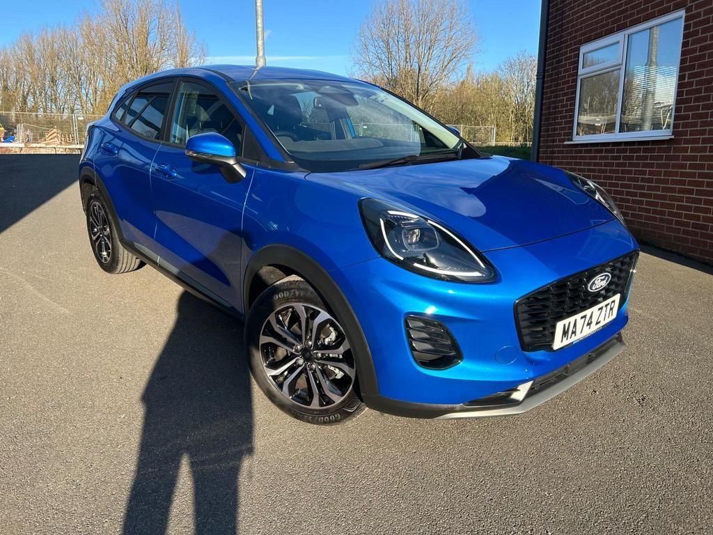 This as new 2024 '74' Ford Puma 1.0t MHEV Titanium automatic has only covered 2,700 miles. It has rear parking sensors and camera, SYNC4, Apple Car Play and more. To buy this great value Puma, phone Mark at Hill and Swift, your independent family run dealership on 01785 813332.