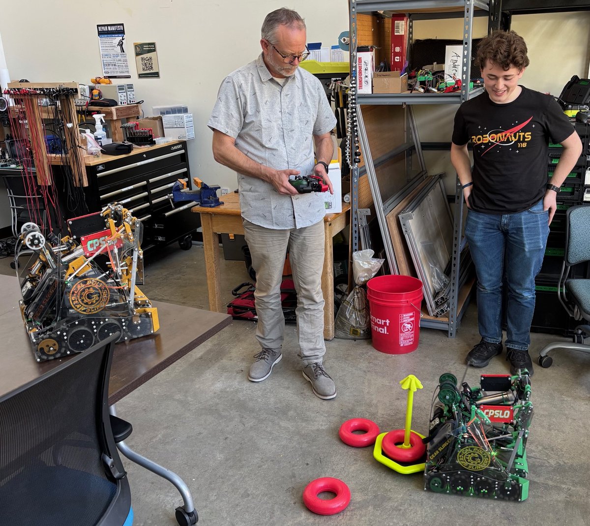 PolyEngineering's tweet image. Interim Dean Robert Crockett met the Cal Poly Gear Slingers and got behind the controls of one of their custom-built robots. The team is gearing up for the VEX U Robotics World Championship in Dallas, May 9 to 11, where they’ll compete with the best collegiate teams in the world.