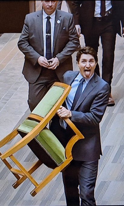 TPostMillennial's tweet photo. Justin Trudeau sticks his tongue out at the camera as he takes his seat from the House of Commons. https://t.co/bzPE9ATPT5
