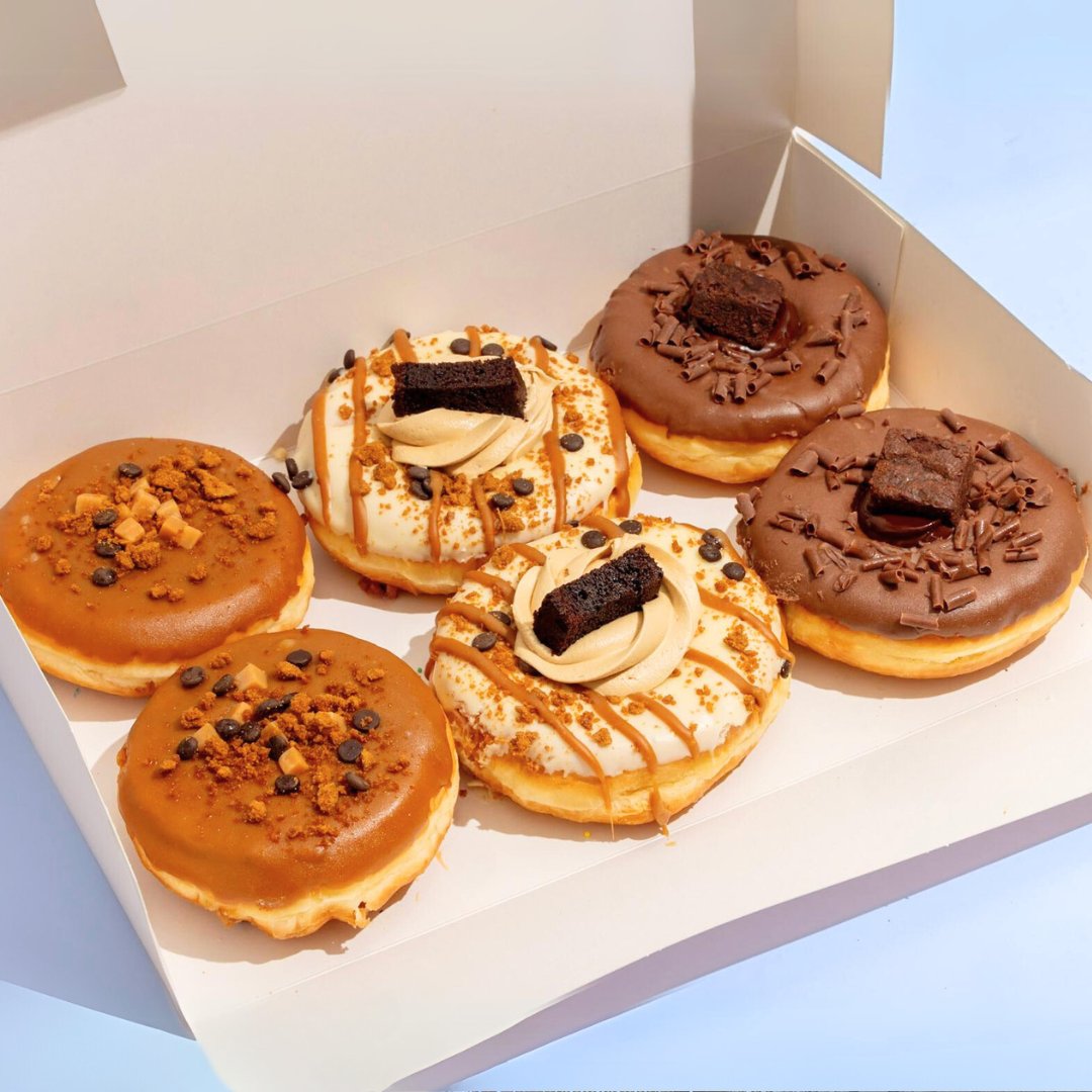 Elevate your taste buds with The Dough Box, a treasure trove of indulgence featuring three heavenly doughnuts.  Each bite is a journey into the sublime, a celebration of flavours that will leave you craving more!
