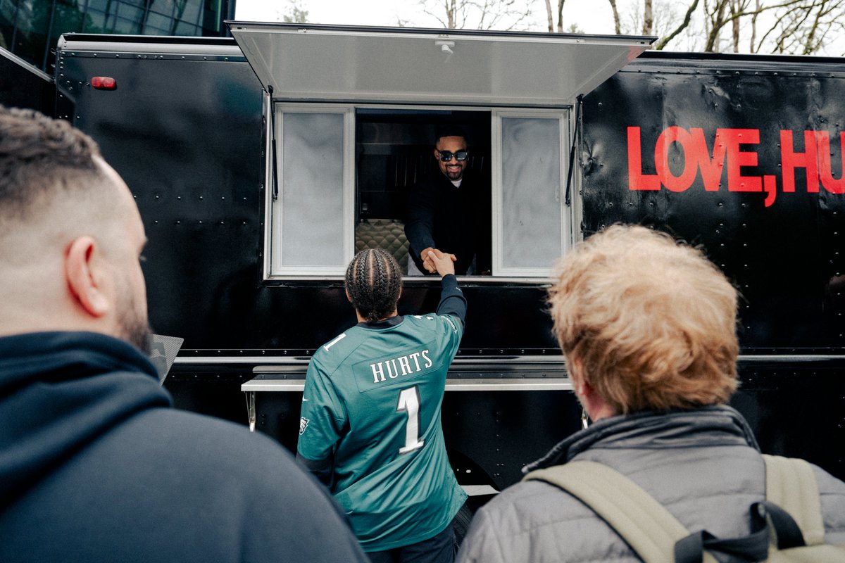Jalen Hurts handing out Love, Hurts shirts to <a href="/Jumpman23/">Jordan</a>  employees at Nike World Headquarters in Beaverton, Oregon