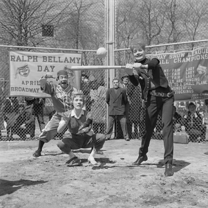 Lucille Ball playing softball in Central Park for the Broadway Show League when she was appearing in "Wildcat".  Julie Andrews, starring in "Camelot" and wearing her crown, is the catcher and Joe E, Brown is the umpire, part of the Broadway Show League.
In Stefan Kanfer’s