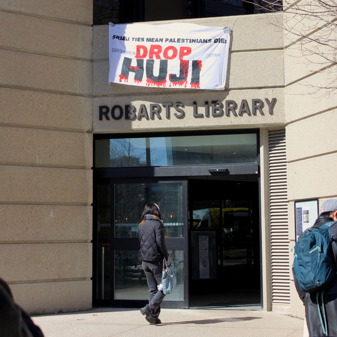 occupyuoft's tweet image. Yesterday we kicked off IAW with two banner drops and a flyer drop focussed on building student awareness around our new campaign: UOFT DROP HUJI. The banners stayed up for well over an hour and numerous students read our fliers, making the actions a resounding success!