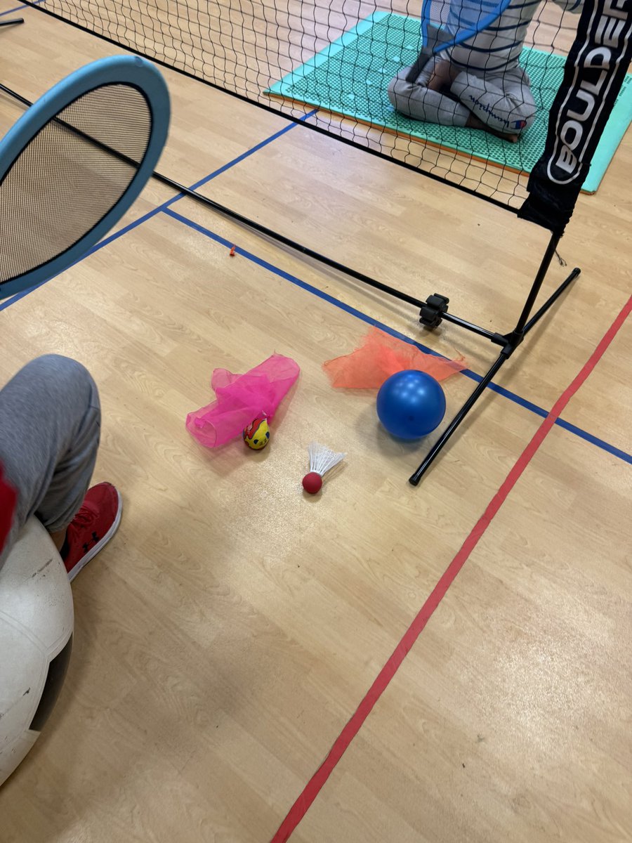 Adapted Badminton with the STEP Model!

✔️ Space: Seated on a sensory moon mat &amp; exercise ball
✔️ Task: Controlled volleys over a lowered net
✔️ Equipment: Adapted racquets, enlarged birdie &amp; balloon birdie
✔️ People: Staff assisting for success

#AdaptedPE