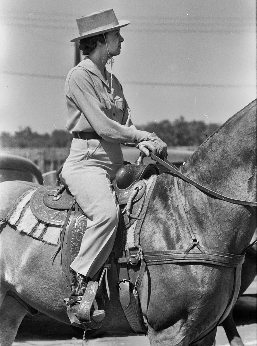 Woman watching a polo match from the best seat in the house. This was taken by Russell Lee in 1939. Because of its history with quarter horses, Texas also has a rich history with polo --- something folks sometimes have a hard time believing. In fact, the man considered the best